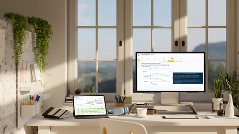 desk with computer showing data